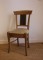 chaise en bois avec dossier en zinc